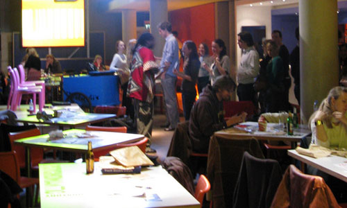 The lower floor of the Dana Centre, with people playing the Rubbish Game.